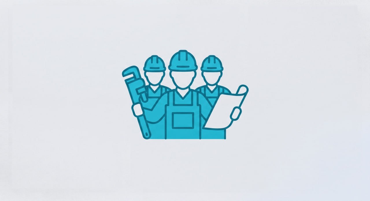 Experienced plumbing team working on residential pipe installation